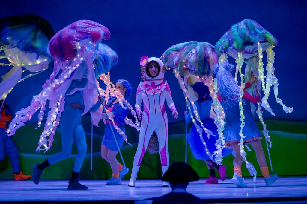 Sandy Cheeks, played by Tommi Lea Harsch, ventures to the jellyfish fields as they dance around her. 