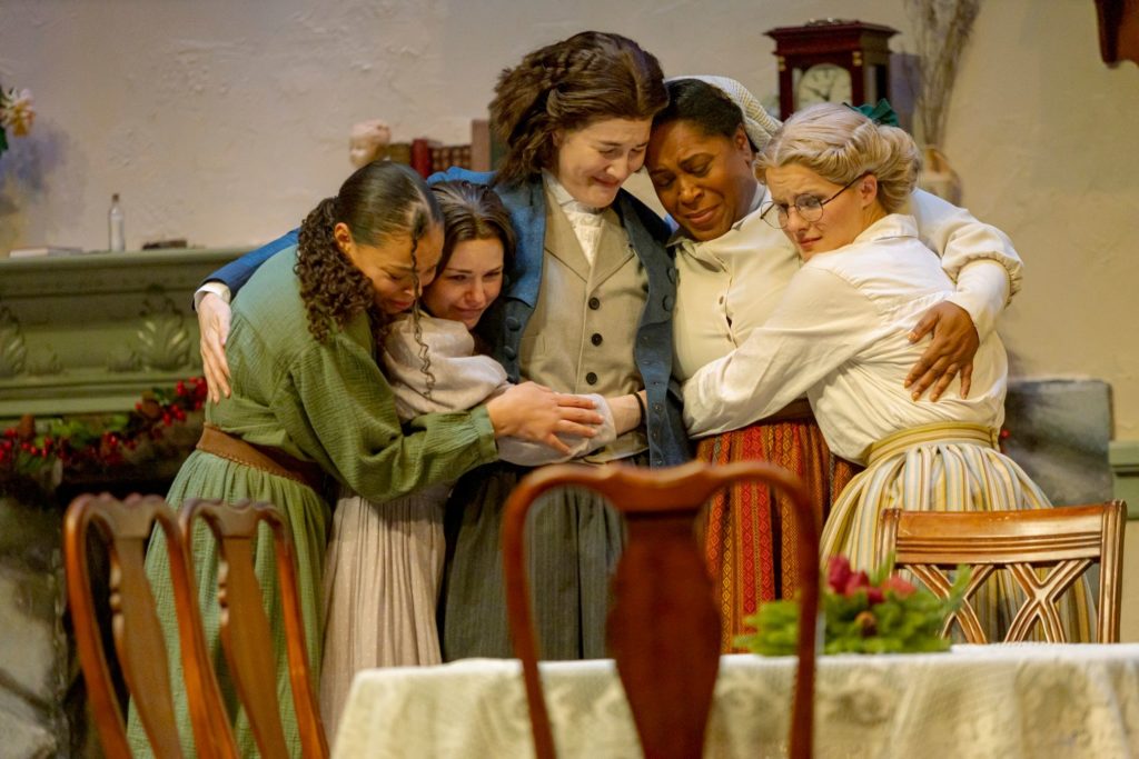 Actors hugging in "Little Women"
