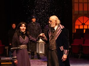 Scrooge and a ghost in A Christmas Carol at NKU.