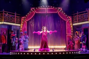 A diva singing La Cage aux Folles at The Carnegie